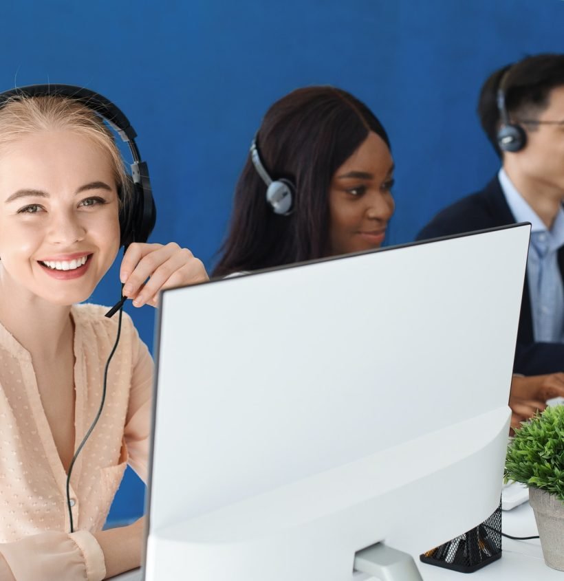 joyful-customer-service-agents-with-headphones-communicating-with-clients-at-call-center.jpg